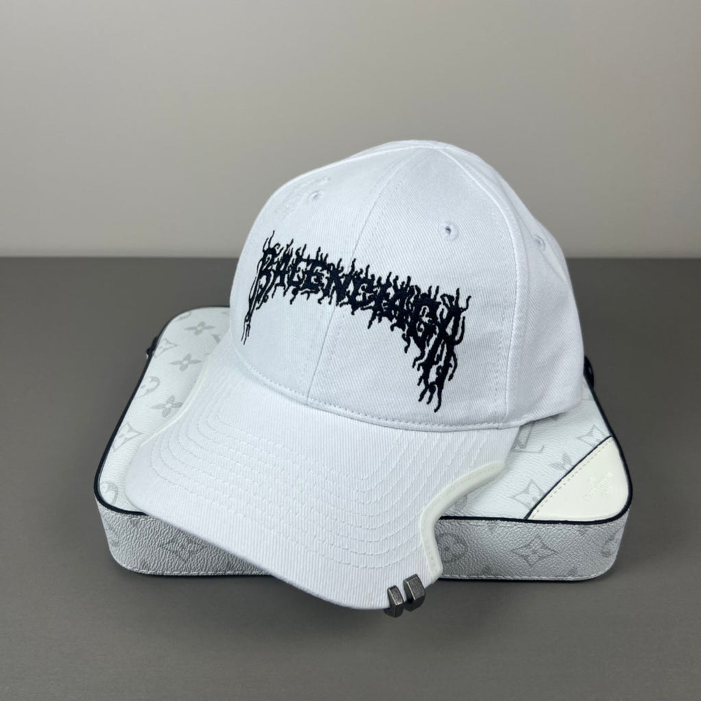 White cotton cap with black graphic embroidery and sculpted brim
