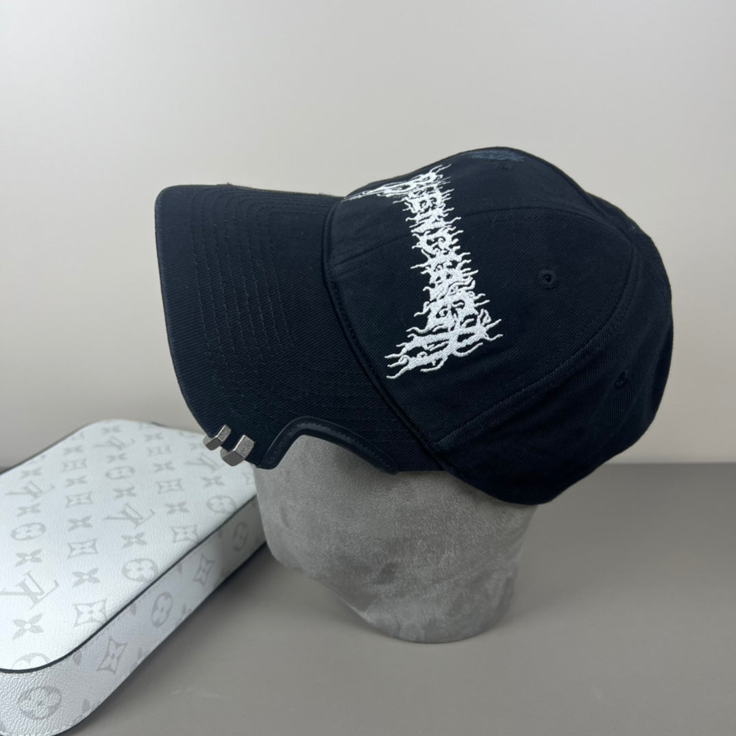 Black cotton cap with flame embroidery and notched brim