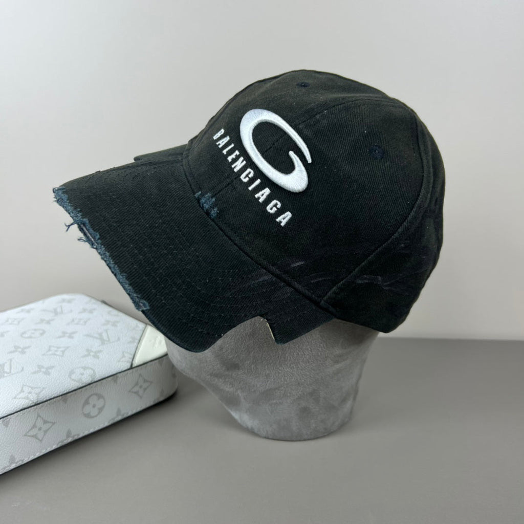 Black distressed cotton cap with contrast emblem and graffiti underbrim