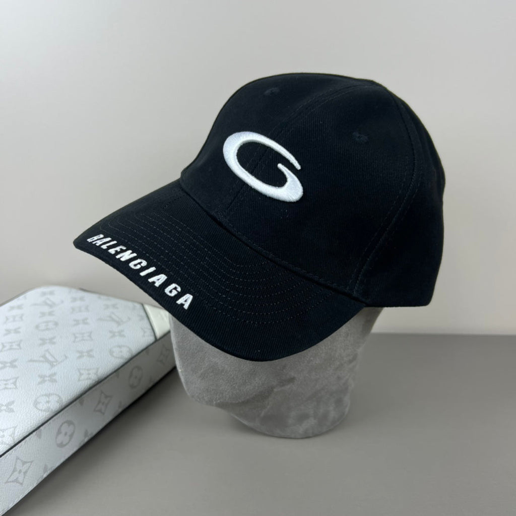 Black cotton cap with white oval emblem embroidery