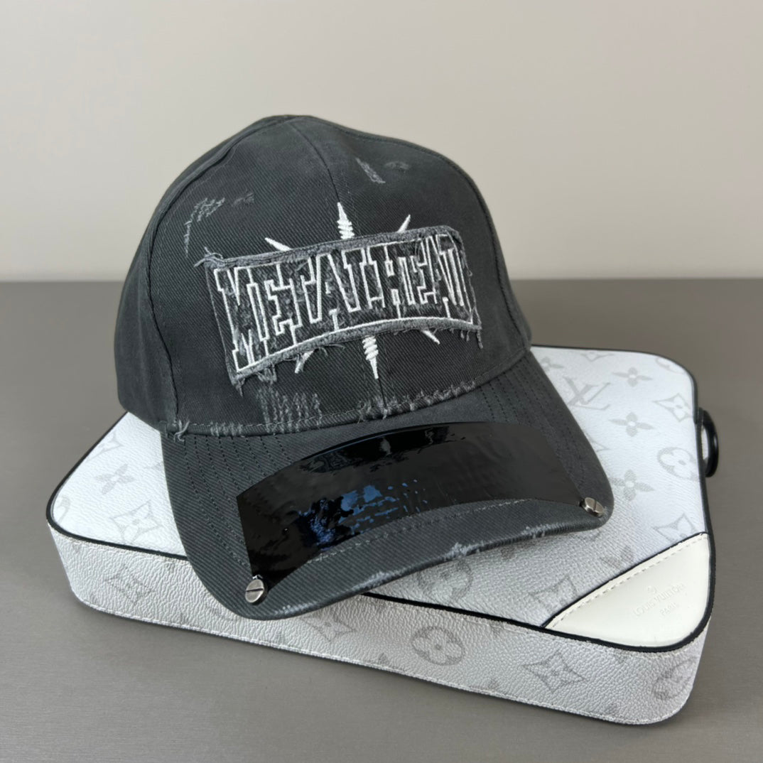Washed black metal patch cap with glossy shield brim