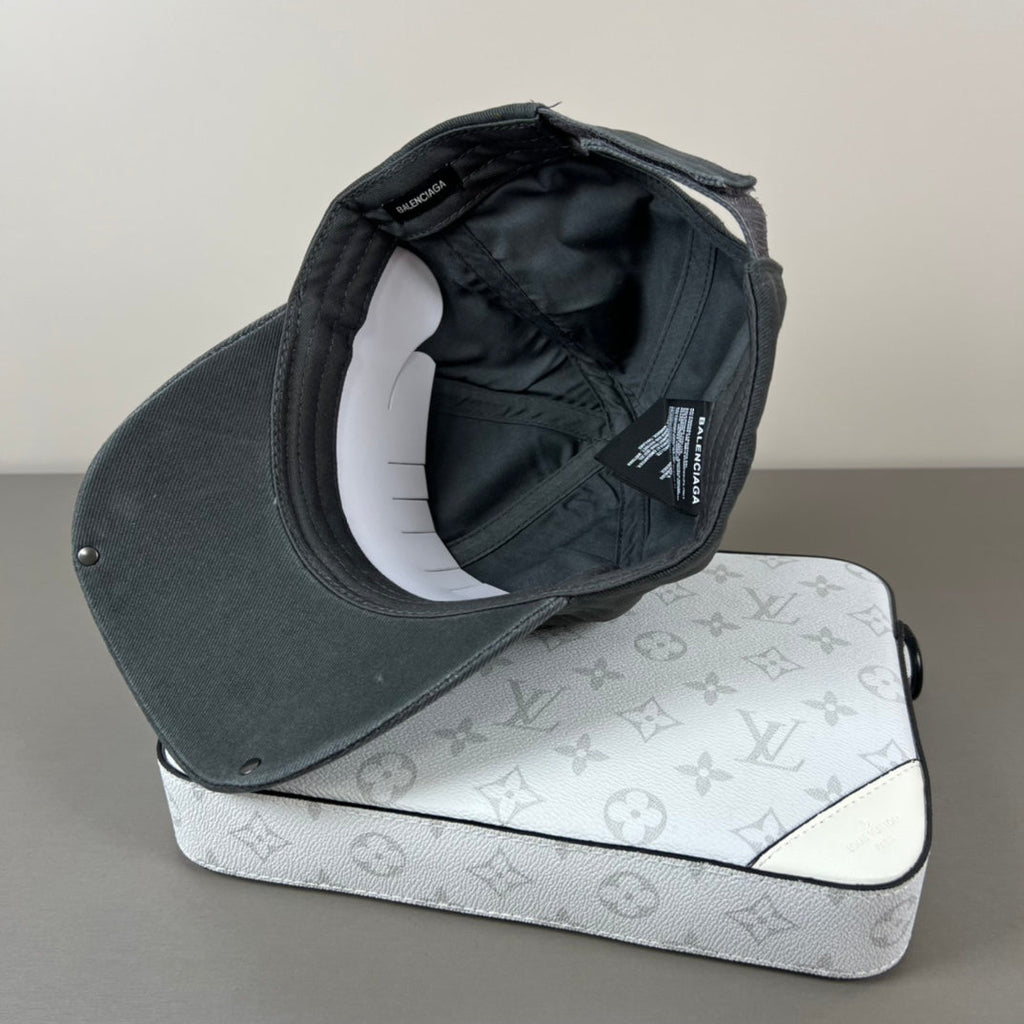 Washed black metal patch cap with glossy shield brim