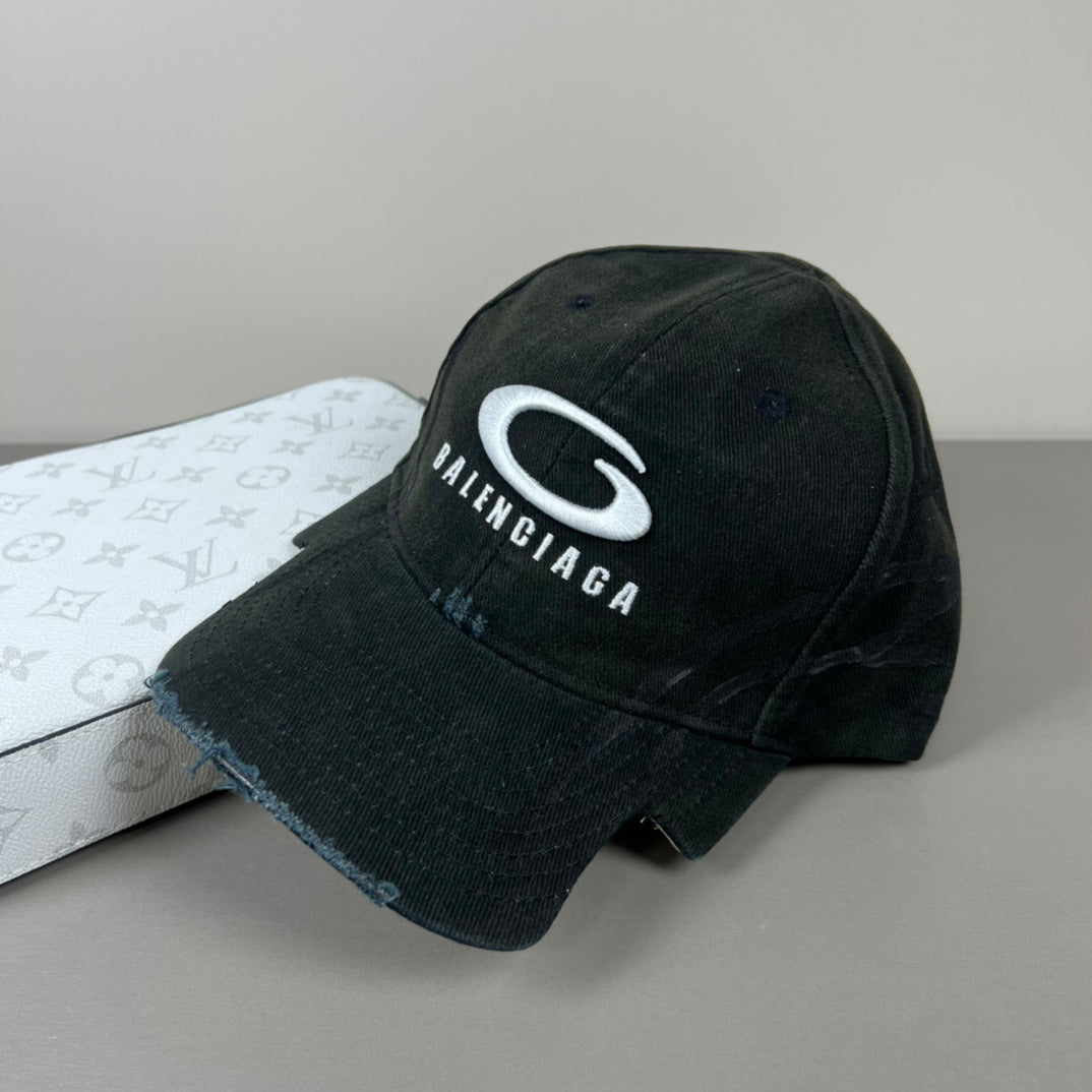Black distressed cotton cap with contrast emblem and graffiti underbrim
