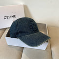Washed blue denim cap with tonal emblem and gold buckle