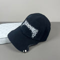 Black cotton cap with flame embroidery and notched brim