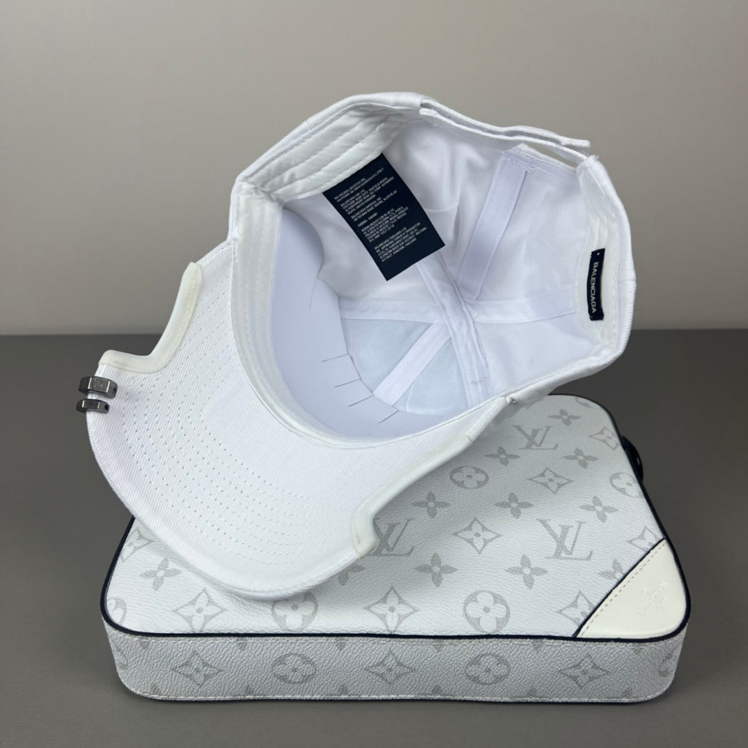 White cotton cap with black graphic embroidery and sculpted brim