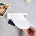White nylon logo‑plaque visor with curved brim