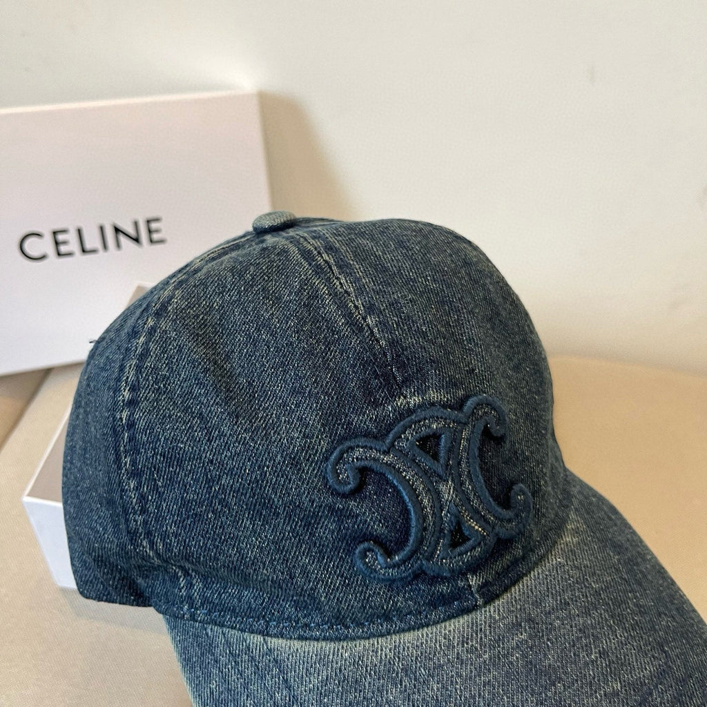 Washed blue denim cap with tonal emblem and gold buckle