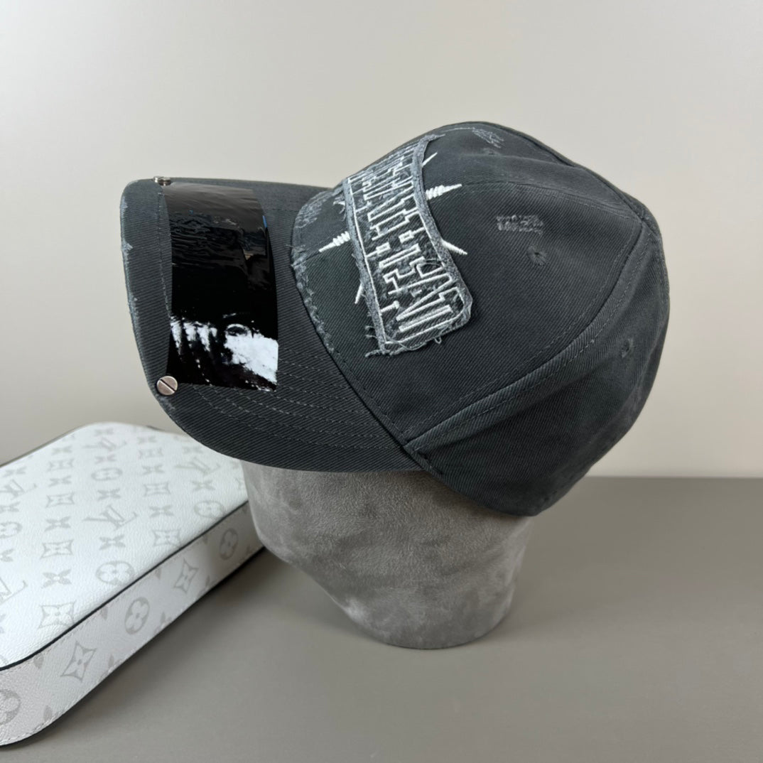 Washed black metal patch cap with glossy shield brim
