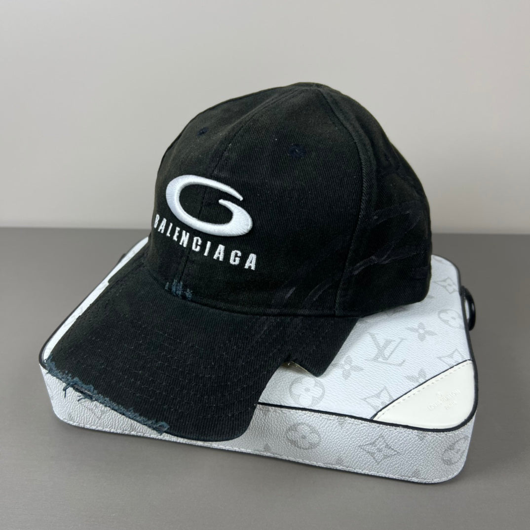 Black distressed cotton cap with contrast emblem and graffiti underbrim
