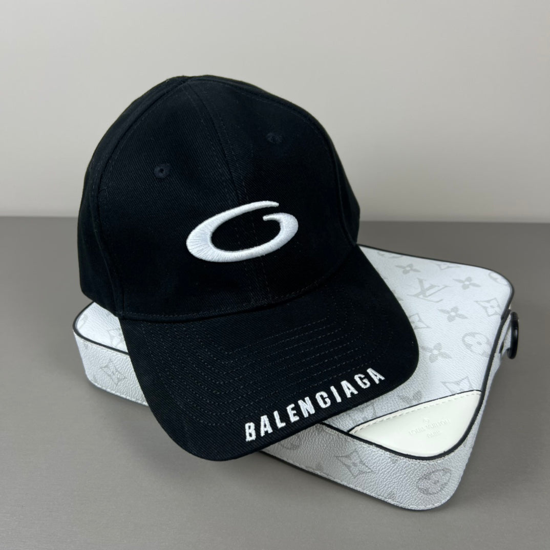 Black cotton cap with white oval emblem embroidery