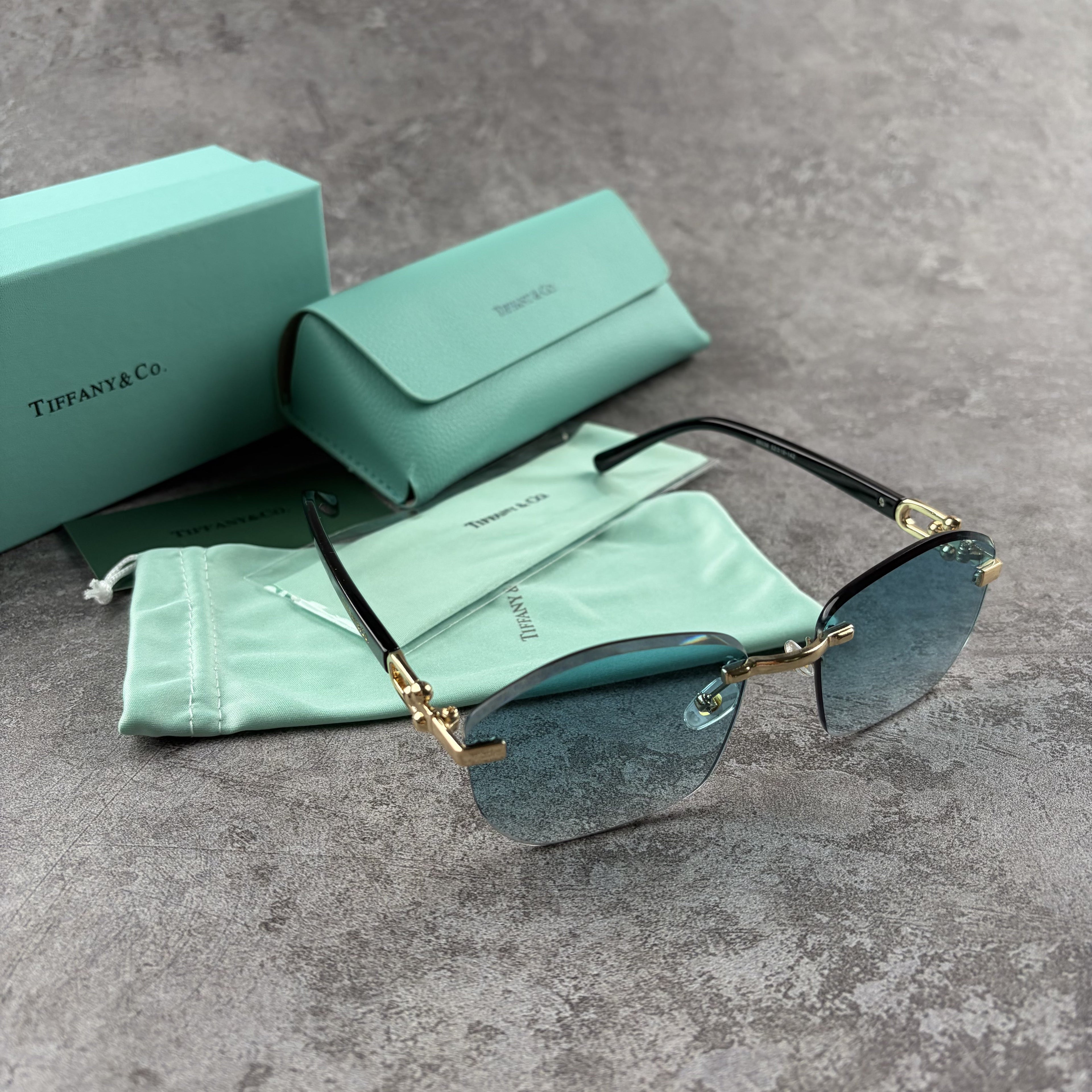 Elegant Rimless Blue Tint Sunglasses – Lightweight Gold Frame