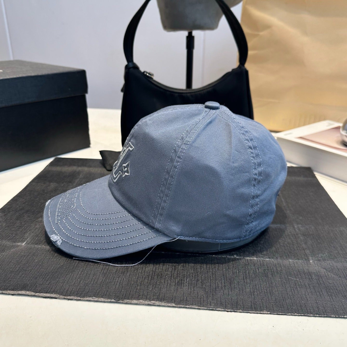 Distressed Denim Baseball Cap with Embroidered Monogram — Washed Blue